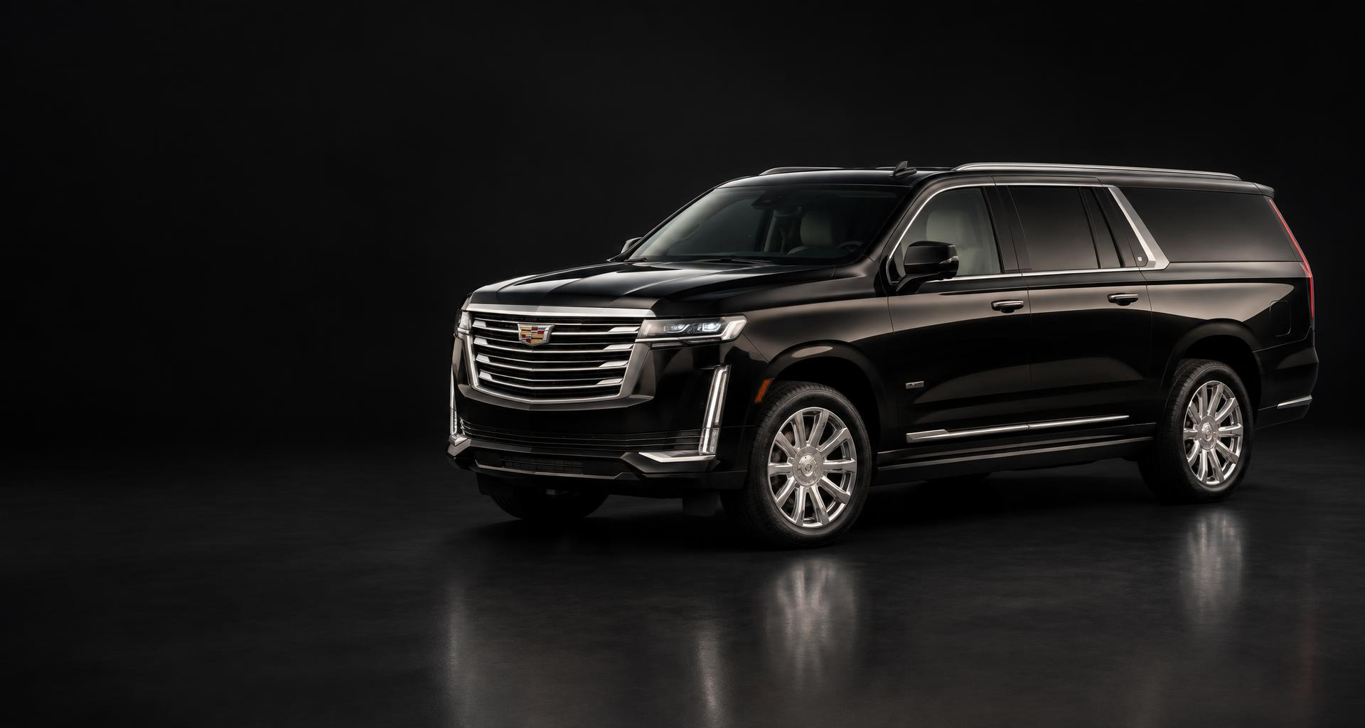 Illustrative black Cadillac Escalade ESV in a dark studio